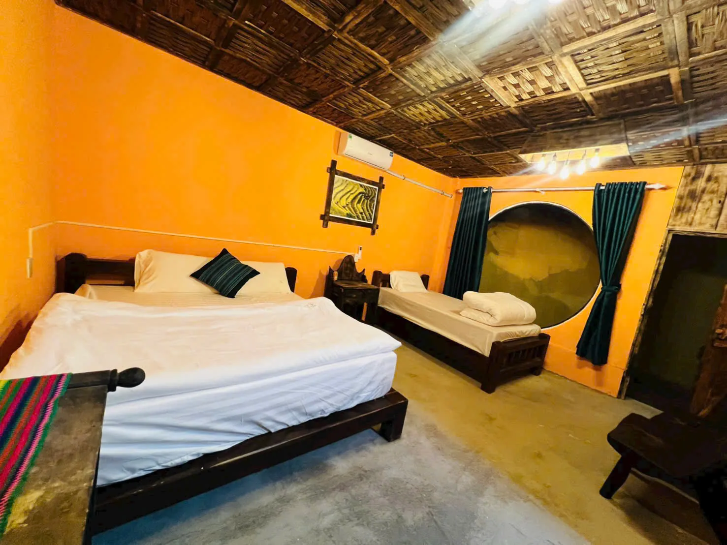 Twin room with double and single bed, bamboo ceiling